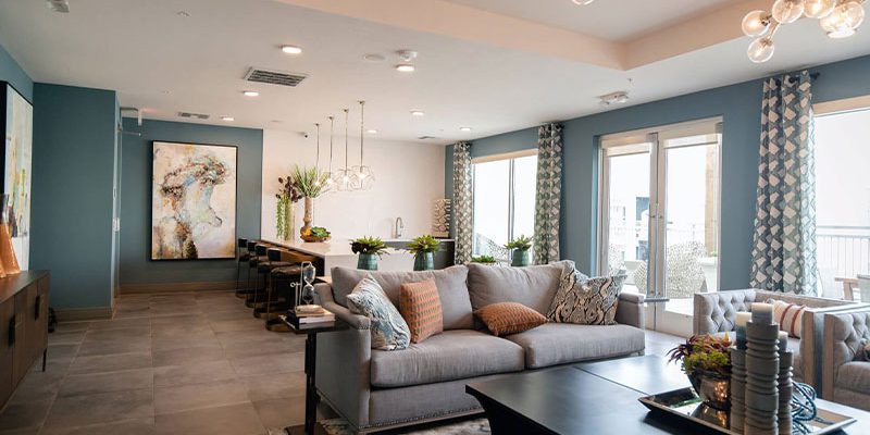 black-wooden-coffee-table-near-white-couch